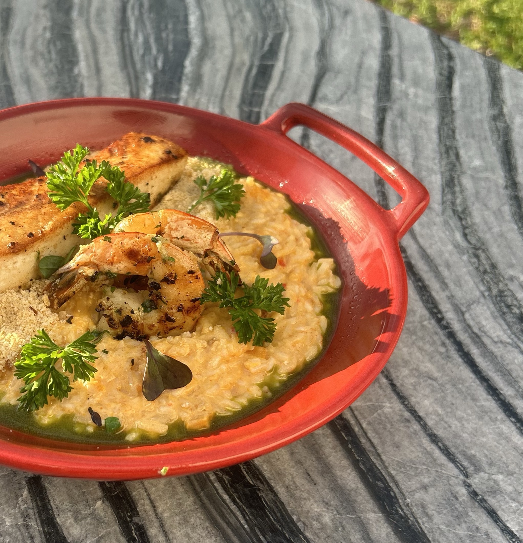 Shrimp risotto in red dish